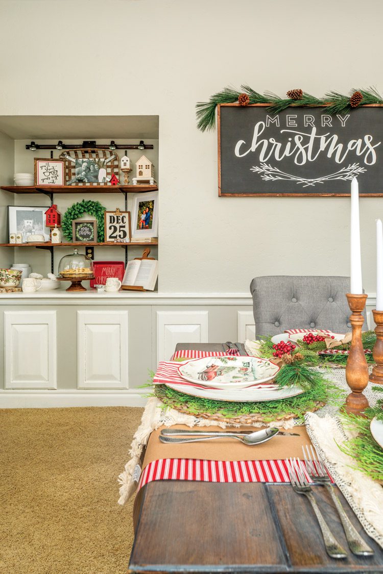 dining room with Christmas greenery and chalkboard