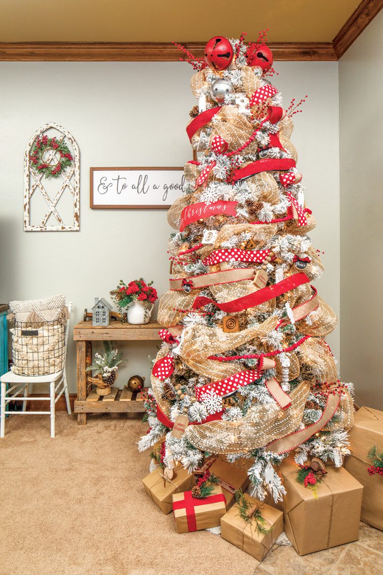 flocked tree with natural and red ribbon