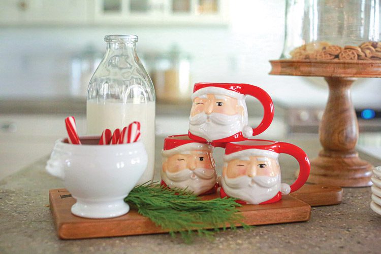 Santa mugs and peppermint sticks with cedar sprig