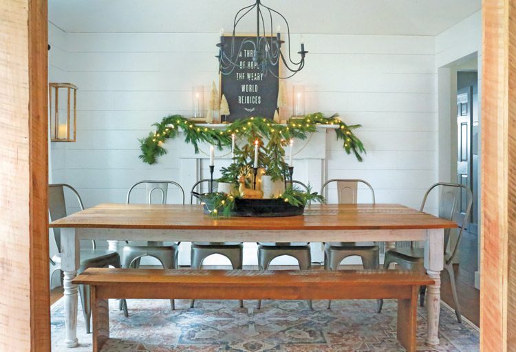 garland and centerpeice with fresh greenery in farmhouse dining room