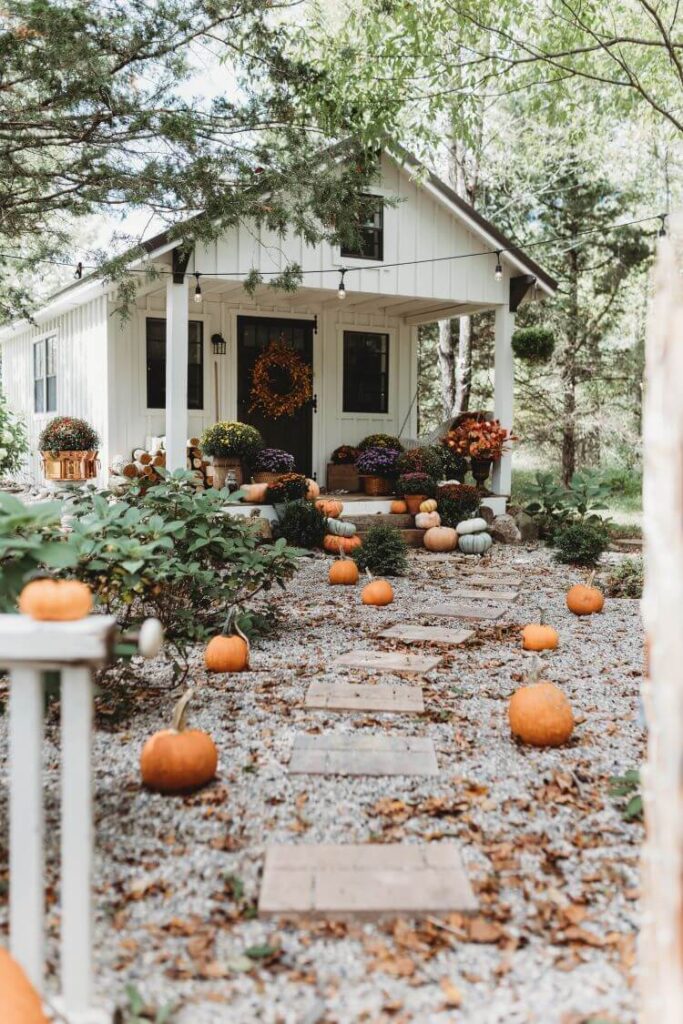 Leading up to the fall she shed, carefully placed pumpkins mark the way to Holly's favorite fall getaway: her she shed!