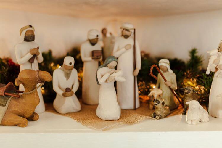 A closeup of a vintage-inspired nativity scene complete with wise men, Mary, Jesus, and assorted farm animals