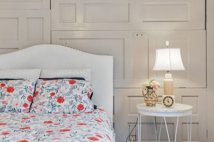 wood paneling on wall in bedroom