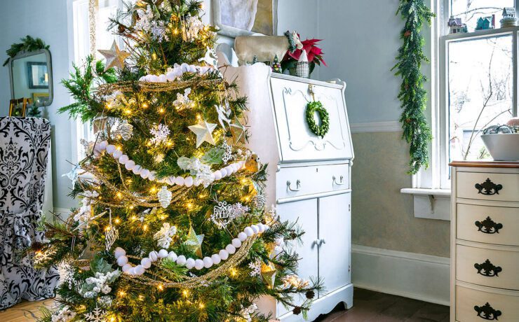 Christmas tree next to doorway to decorate with lights at Christmastime