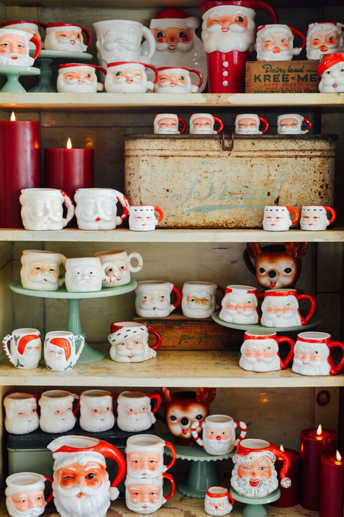 Shelves with vintage Santa mugs and to decorate with lights at Christmastime