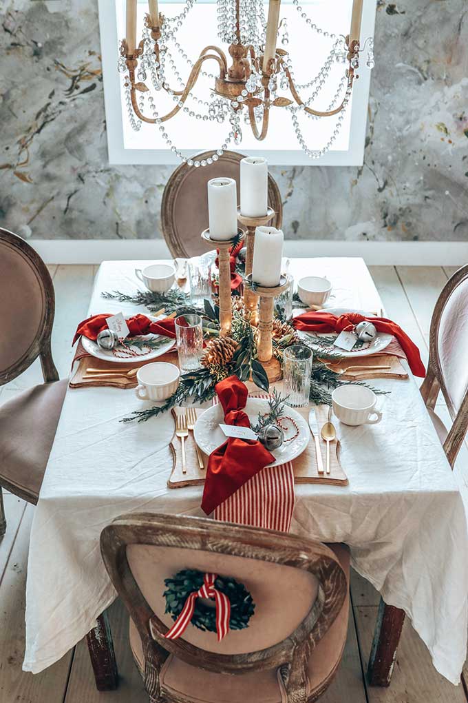 cozy and festive holiday tablescape with pops of red