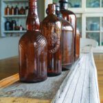 Amber glass bottles lined up on a shelf