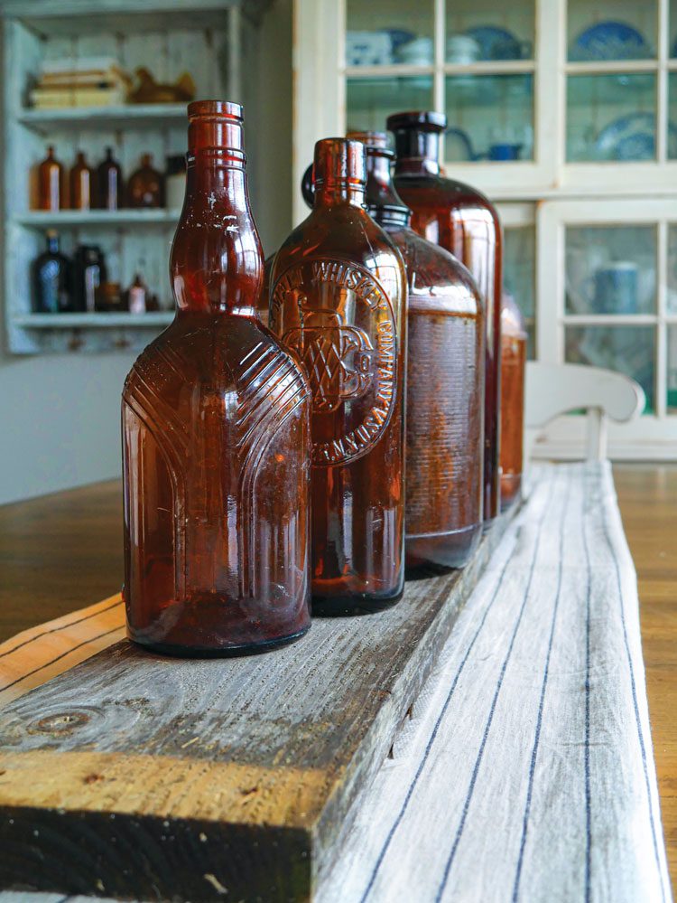 Amber glass bottles lined up on a shelf