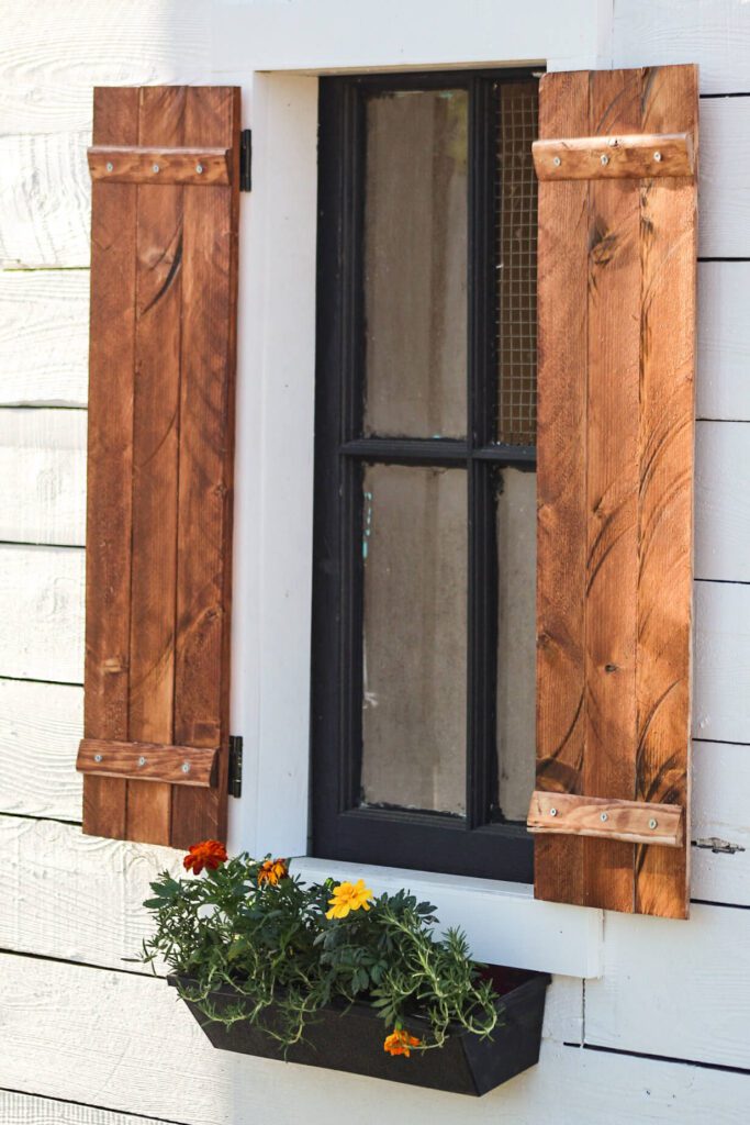 planter box and shutters on chicken coop exterior