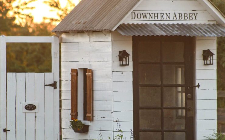 chicken coop exterior with lighting and overhang