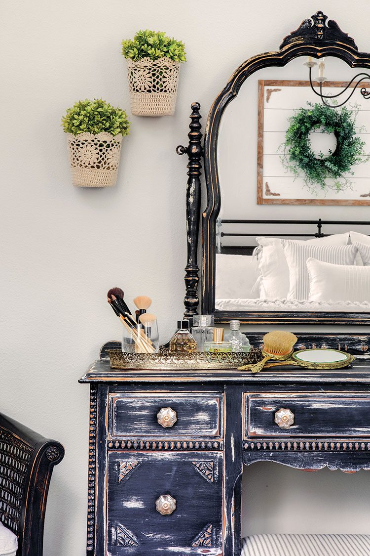 vintage dresser with mirror in farmhouse master bedroom