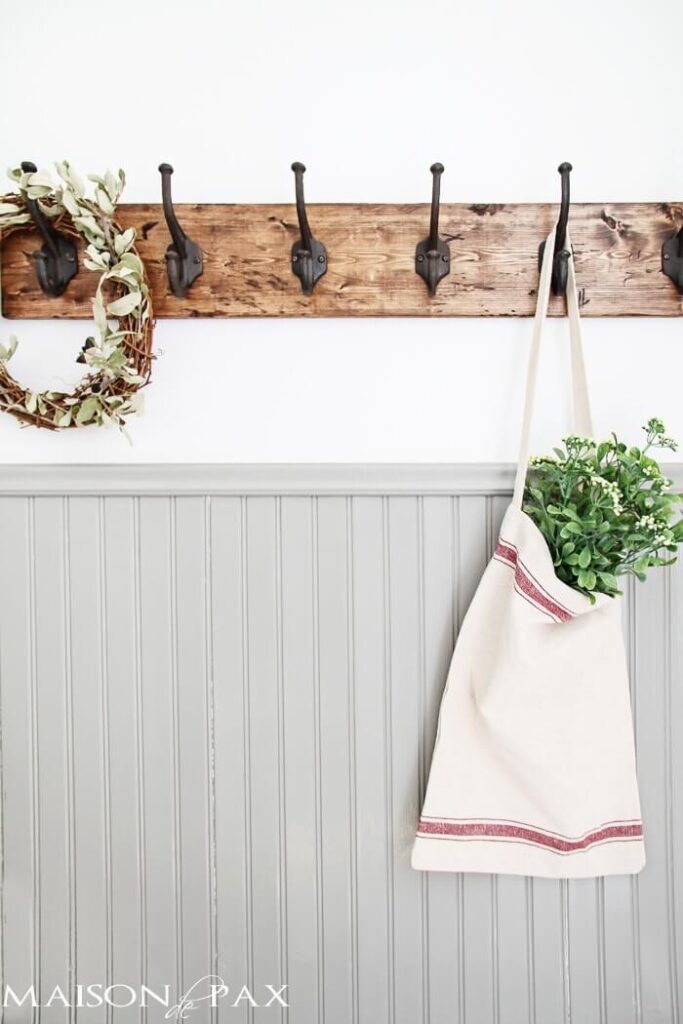 Wall with wainscoting and coat hooks