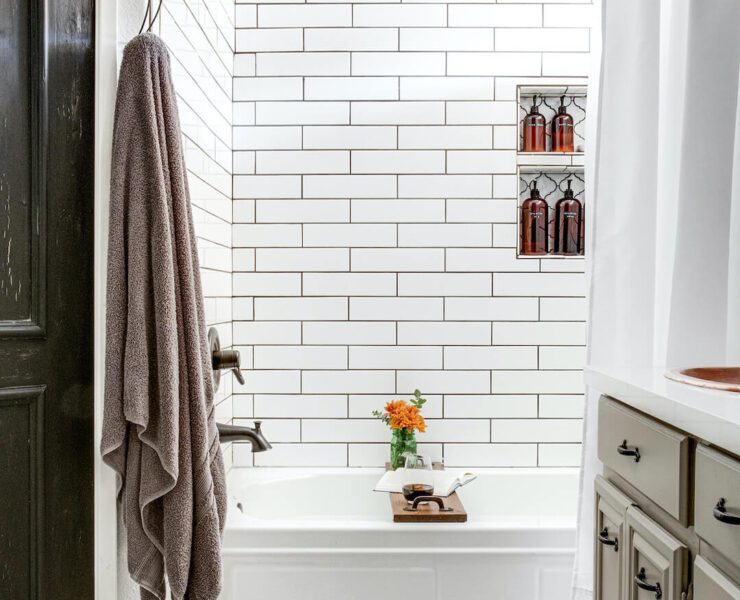 black and white floral mosaic tile in bathroom with white subway tile