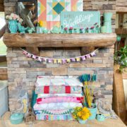 mantel with colorful quilts and pottery