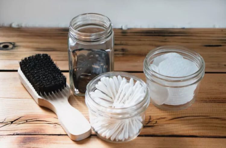 cotton rounds, cotton swabs, and hair ties in candle jars