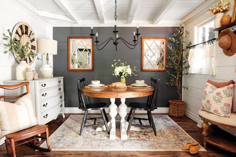 Dining space in a New Jersey farmhouse with gray walls, shiplap and exposed ceiling beams What Is Farmhouse Cottage Style?