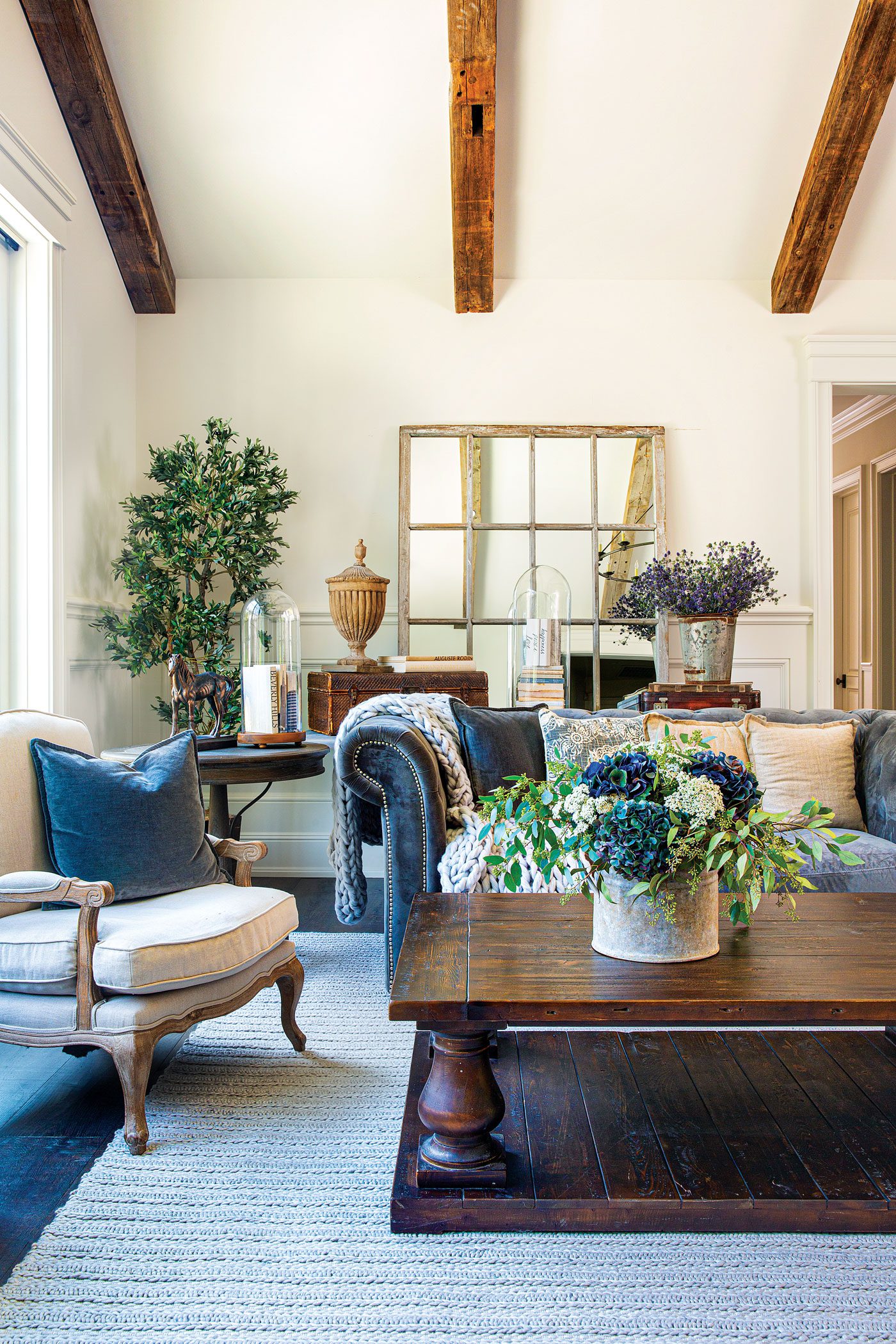 The vaulted ceilings in the living room are original to the home, but Karen and her husband added the exposed beams.