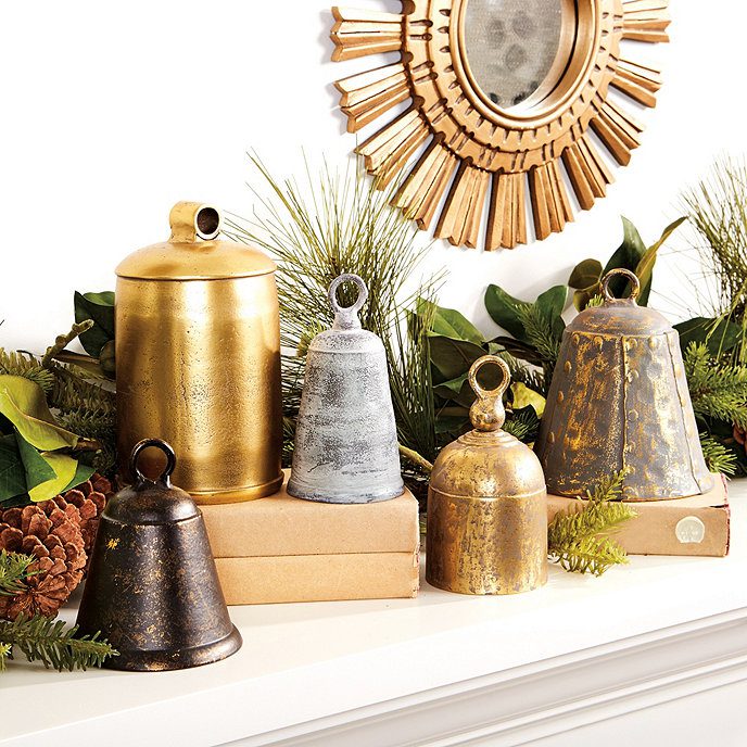 Mantel with a set of vintage farmhouse style cow bells