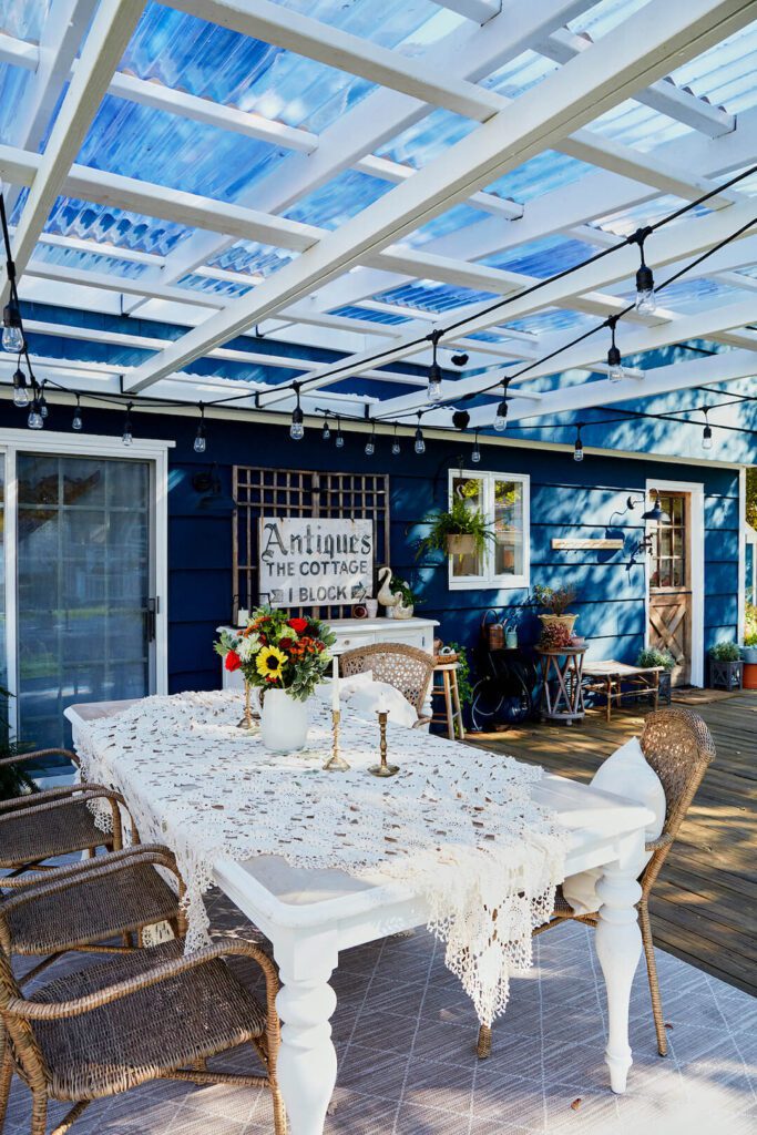 covered deck with dining area