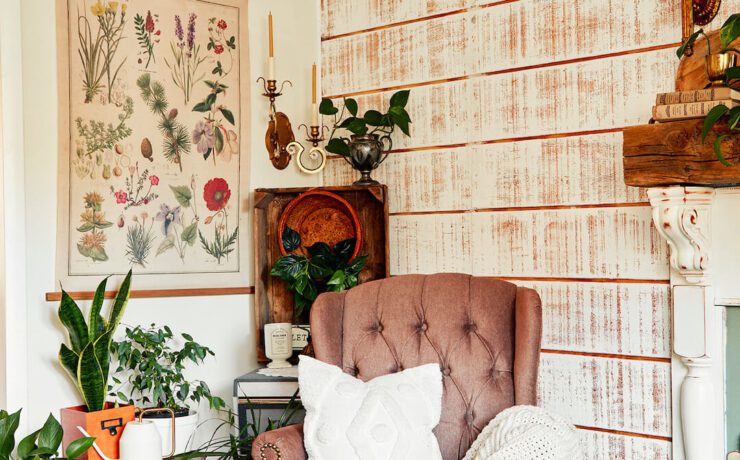 living room with tufted wingback chair and botanical print