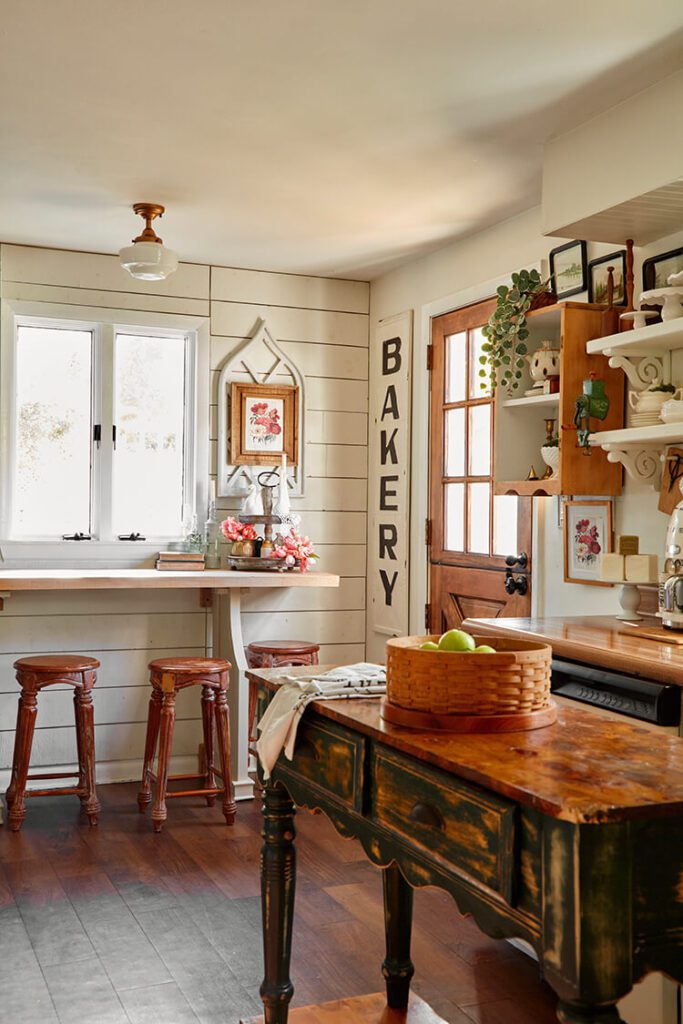 kitchen with shiplap walls and wood island