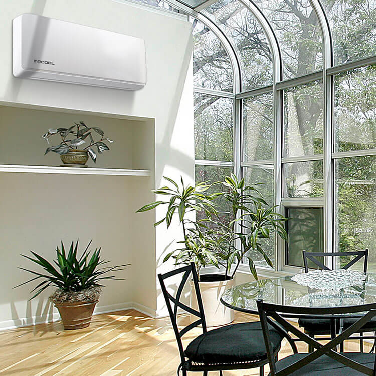 MR COOL Air conditioning unit in sunroom next to glass wall