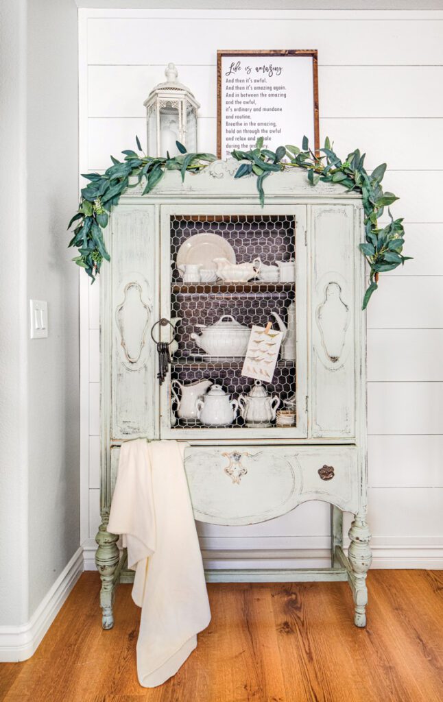 A cabinet with vintage ironstone and stoneware collection