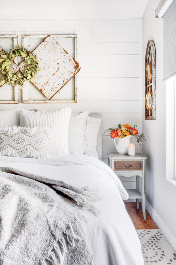 The shiplap wall behind the bed