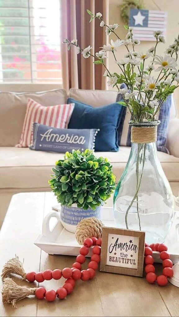 Living room scene with 4th of July throw pillows and garland.