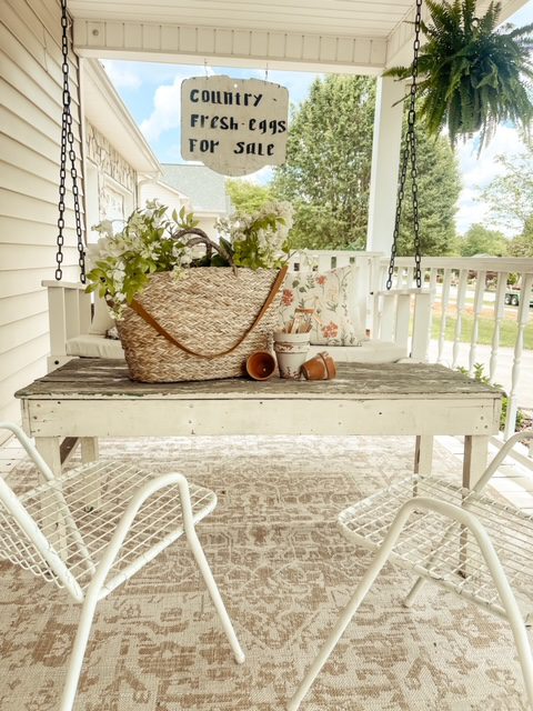 Jessica Sigmon's front porch with charming table and spring decor