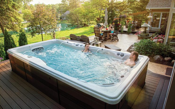 People relaxing in a swim spa
