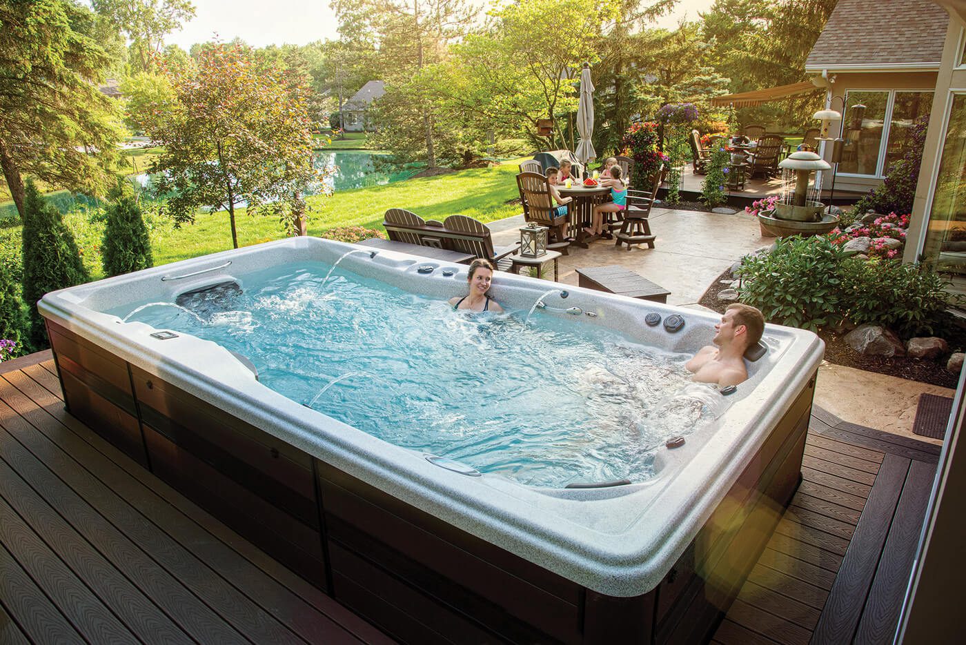 People relaxing in a swim spa