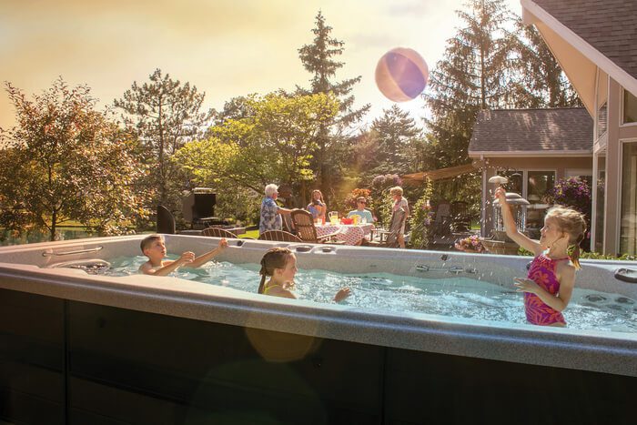 Kids playing in a swim spa