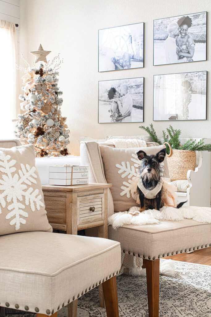 neutral upholstered chairs with white snowflakes and flocked white Christmas tree