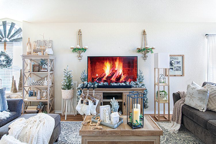 living room with potted mini trees garlands and wreaths