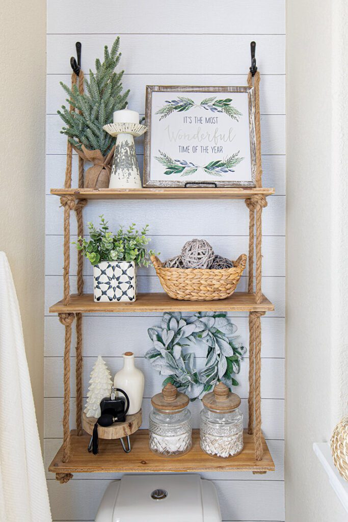 bookshelf with festive greenery