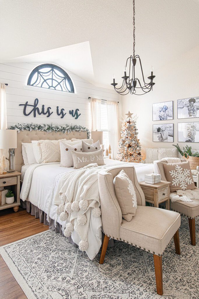 shiplap bedroom with white layered bedding and white Christmas tree
