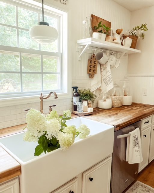 Kitchen with farmhouse sink in Jessica Sigmon house with butcher block countertops