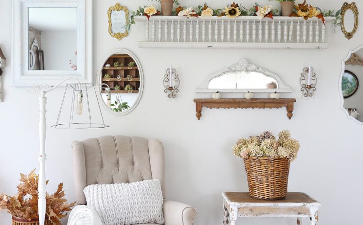 Sitting area with white chair, fall decor and dried hydrangeas for fall farmhouse style