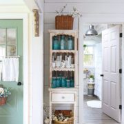 hutch with vintage blue jars