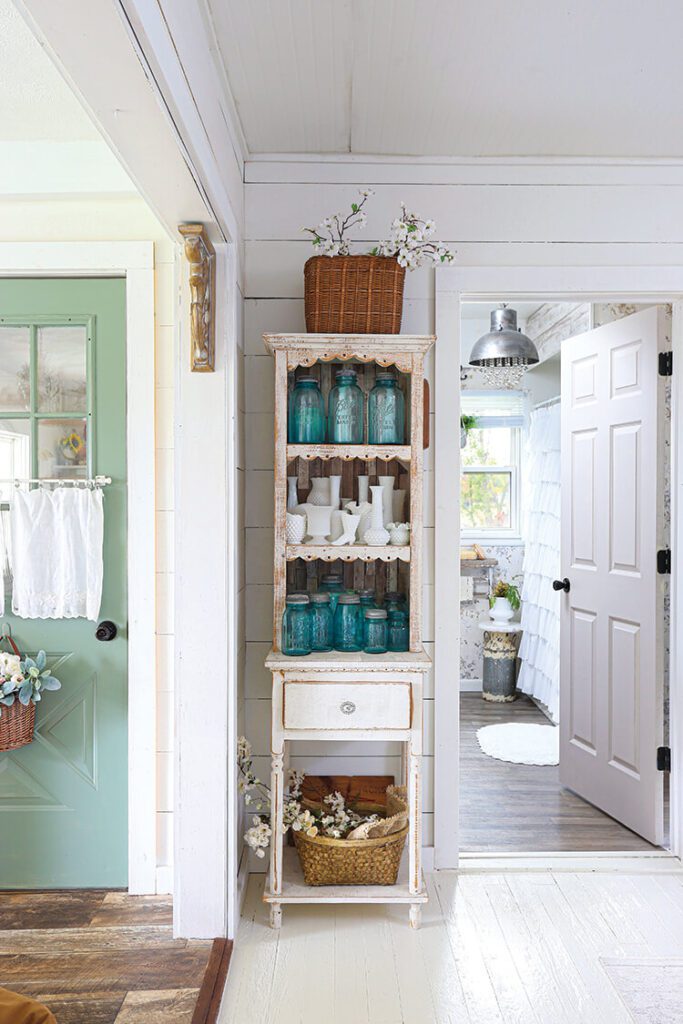 hutch with vintage blue jars