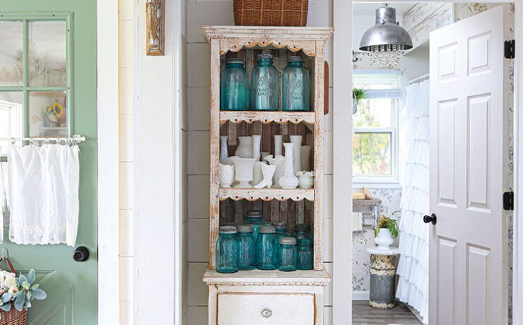 hutch with vintage blue jars