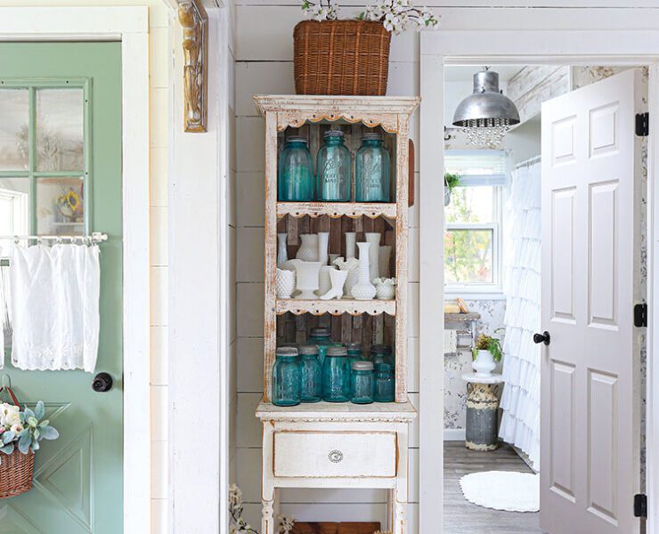 hutch with vintage blue jars