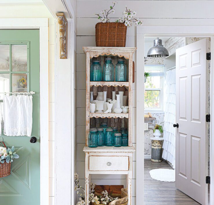 hutch with vintage blue jars