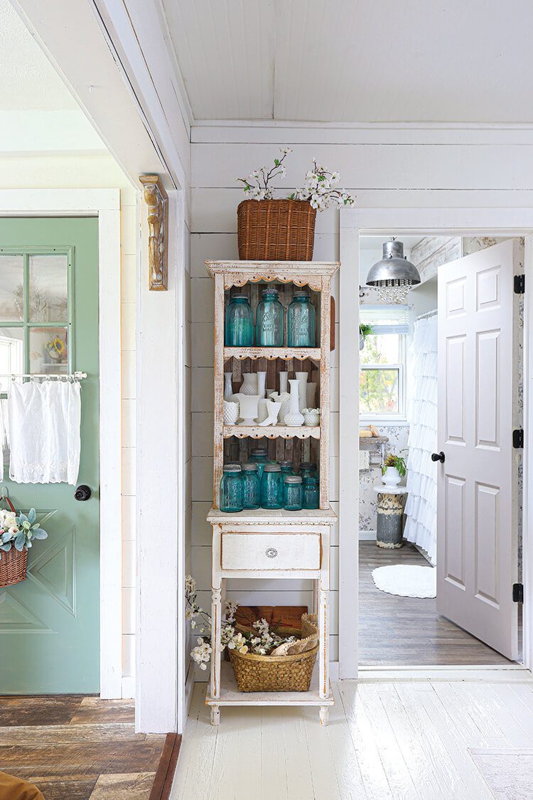 hutch with vintage blue jars