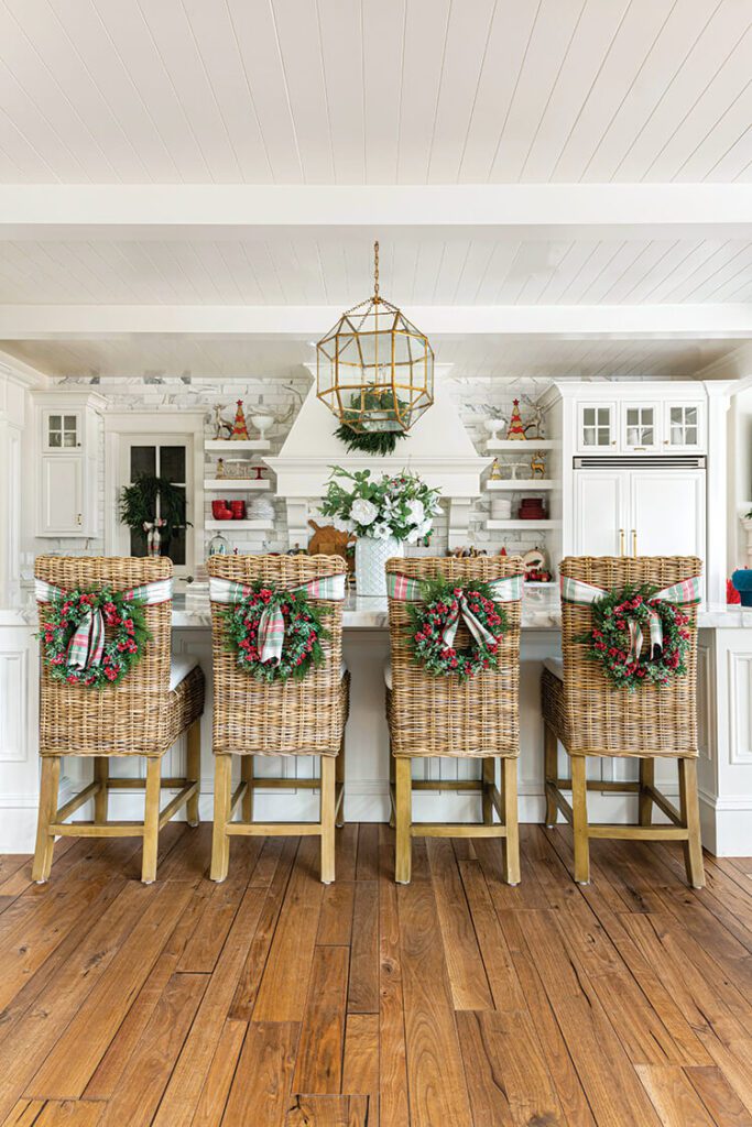 wreath and ribbon on woven kitchen bar chairs