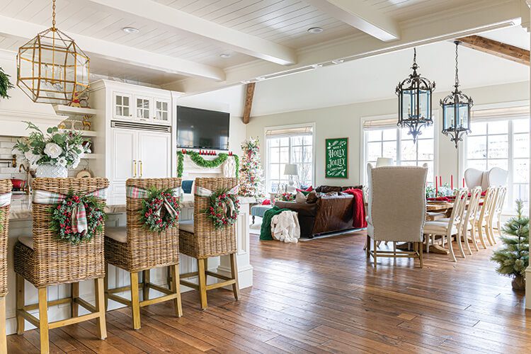 open concept kitchen and dining decorated for holidays