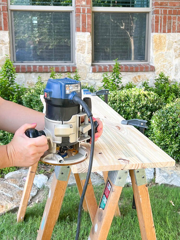 woman outside using power tool