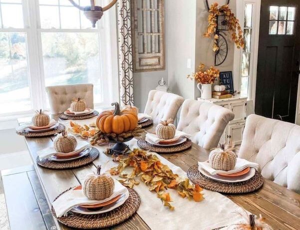 A cozy white farmhouse style vibe is blended with Halloween touches like white crocheted pumpkins.