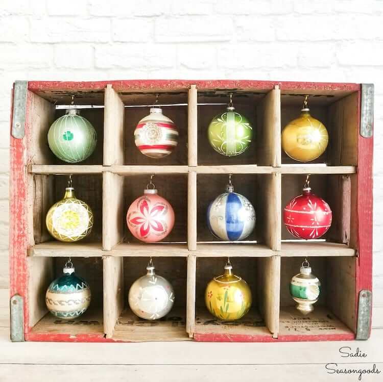vintage ornaments in wooden crate display